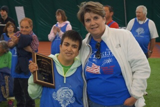 SLV Health CEO Konnie Martin stands with Karie Valdez at the Special Olympics.
