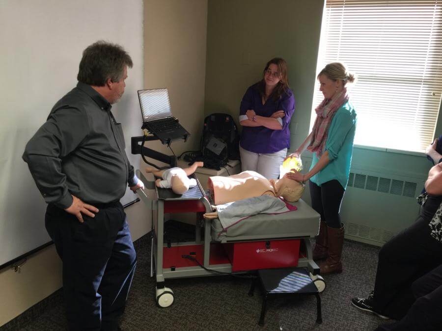 Tiffany Hoover tries out a resuscitation simulation.